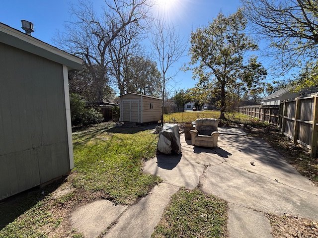 Backyard and storage shed of as-is Baytown TX home sold for cash to Volcan Property Buyers