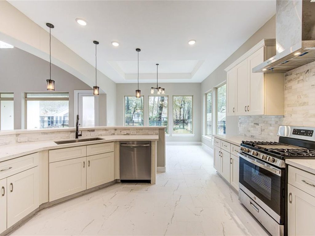 Kitchen with waterfall island in a Panorama, Conroe TX home resolved from foreclosure