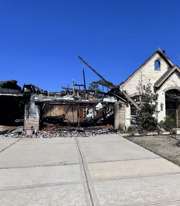 Fire-damaged Atascocita home requiring significant restoration before a traditional sale