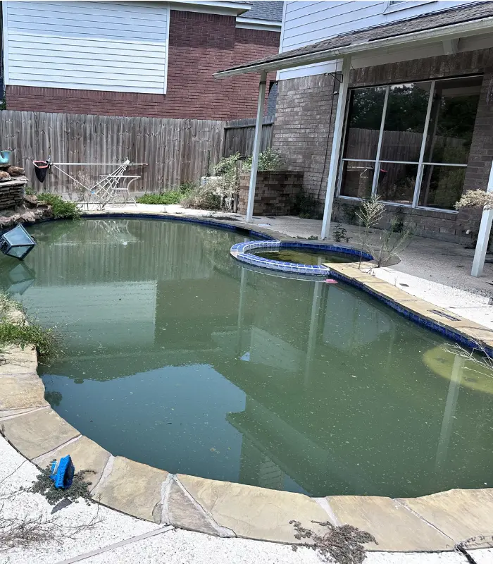 Atascocita property affected by standing water and drainage issues behind the home