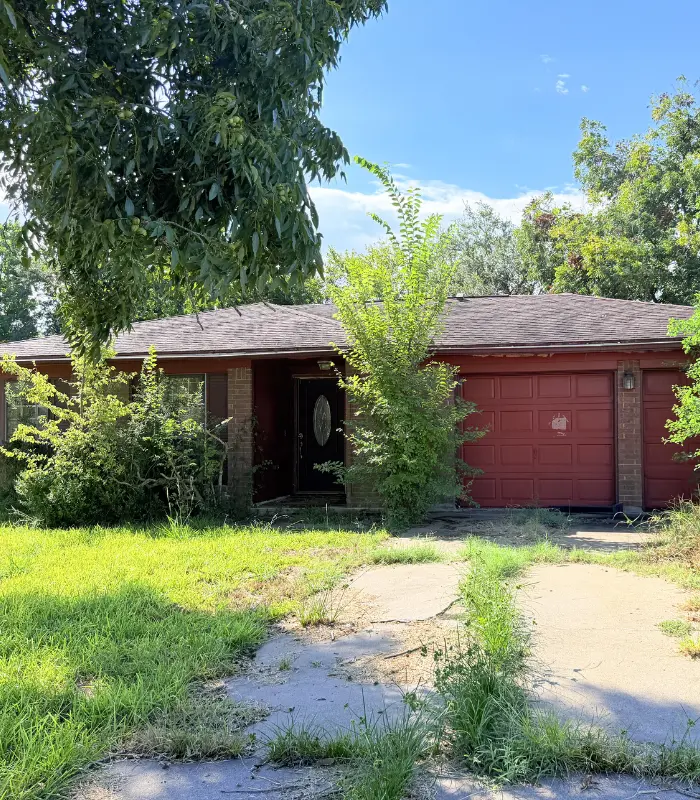 Baytown property with detached garage and outdoor areas that may need repairs before listing
