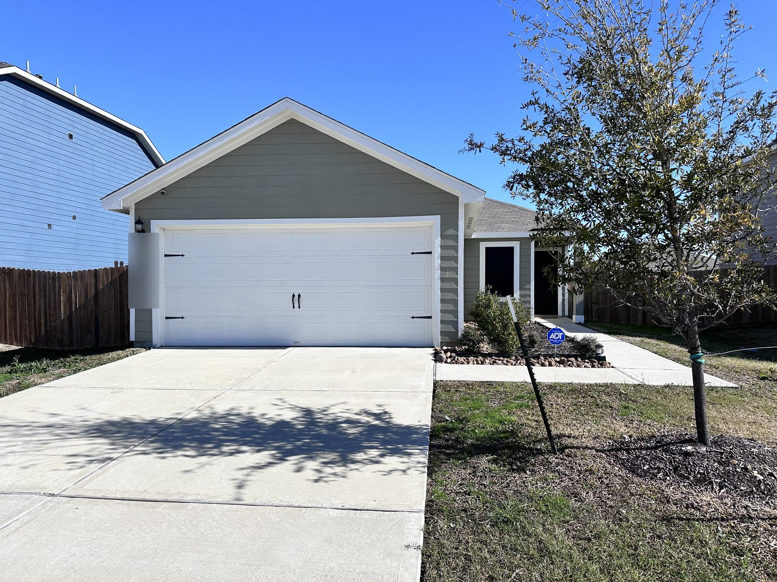 Front exterior of nearly new home bought for cash as-is in Mont Belvieu, TX