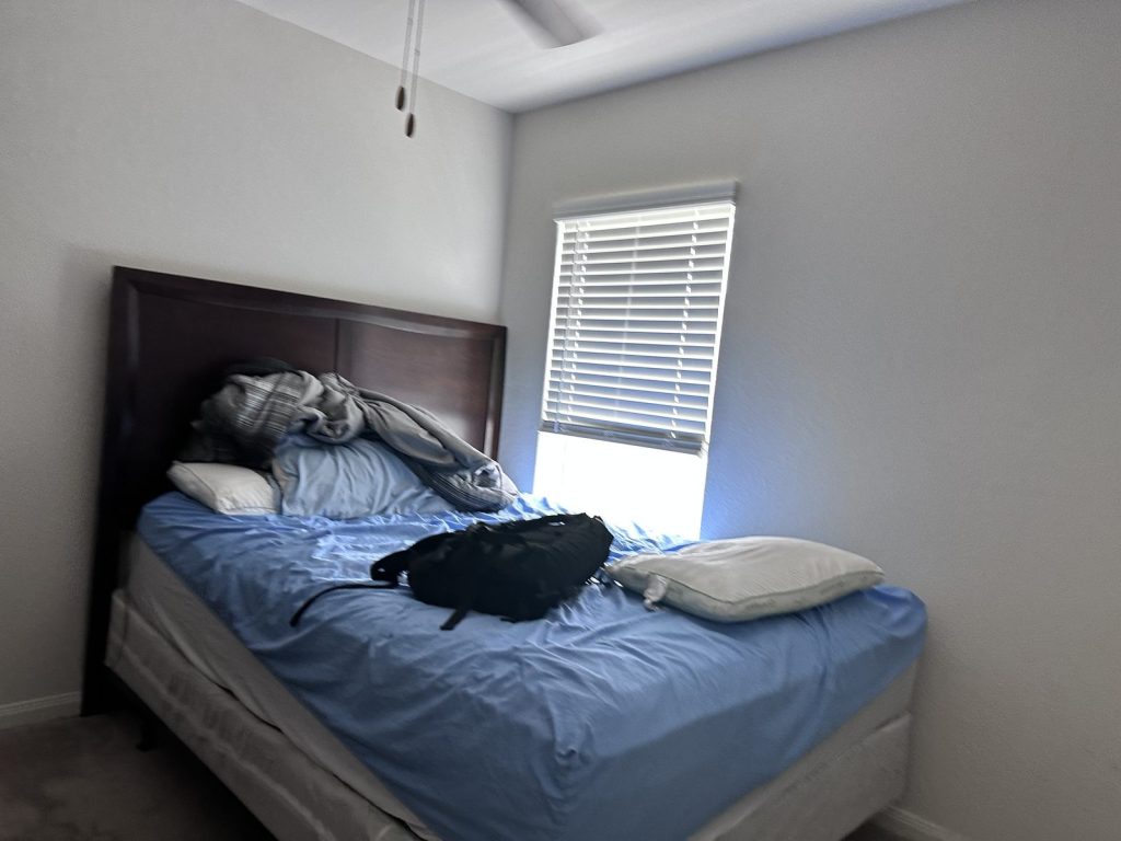 Bedroom of Mont Belvieu, TX home sold as-is for cash to Volcan Property Buyers