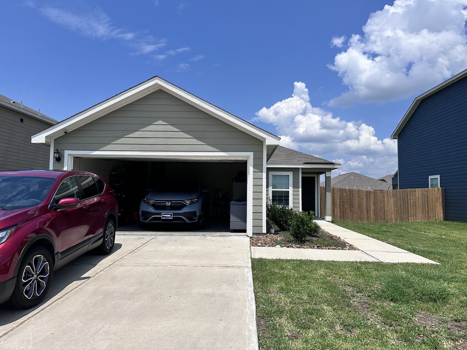 Front exterior of single-story home bought for cash before foreclosure in Mont Belvieu, TX