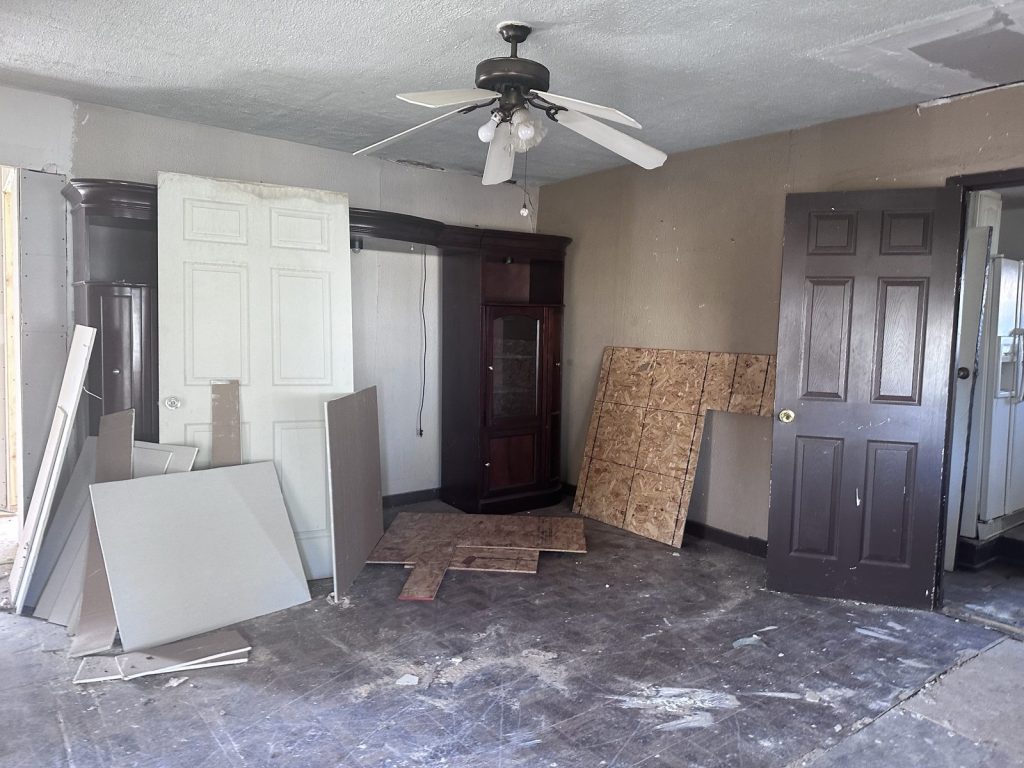 Stripped interior of vandalized vacant home purchased as-is by cash home buyers in Baytown TX
