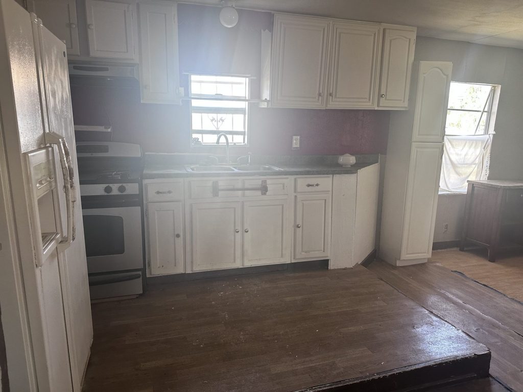 Kitchen of vacant Goose Creek home sold as-is for cash in Baytown TX