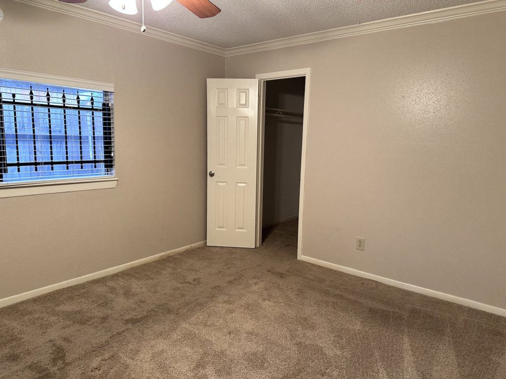 Bedroom in an inherited Briargate home in Missouri City, TX sold as-is