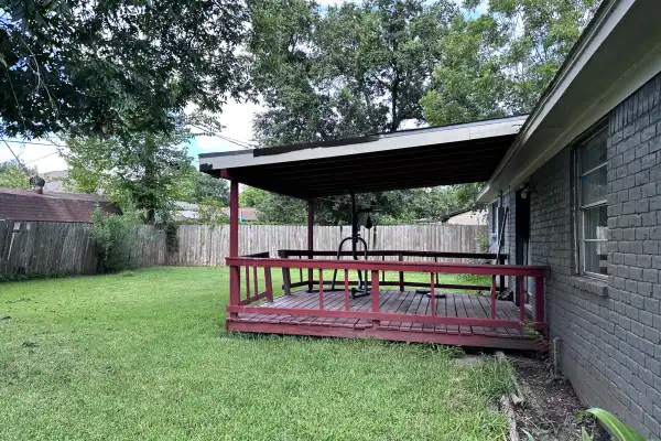 Backyard of distressed Harold Street property purchased as-is in Houston
