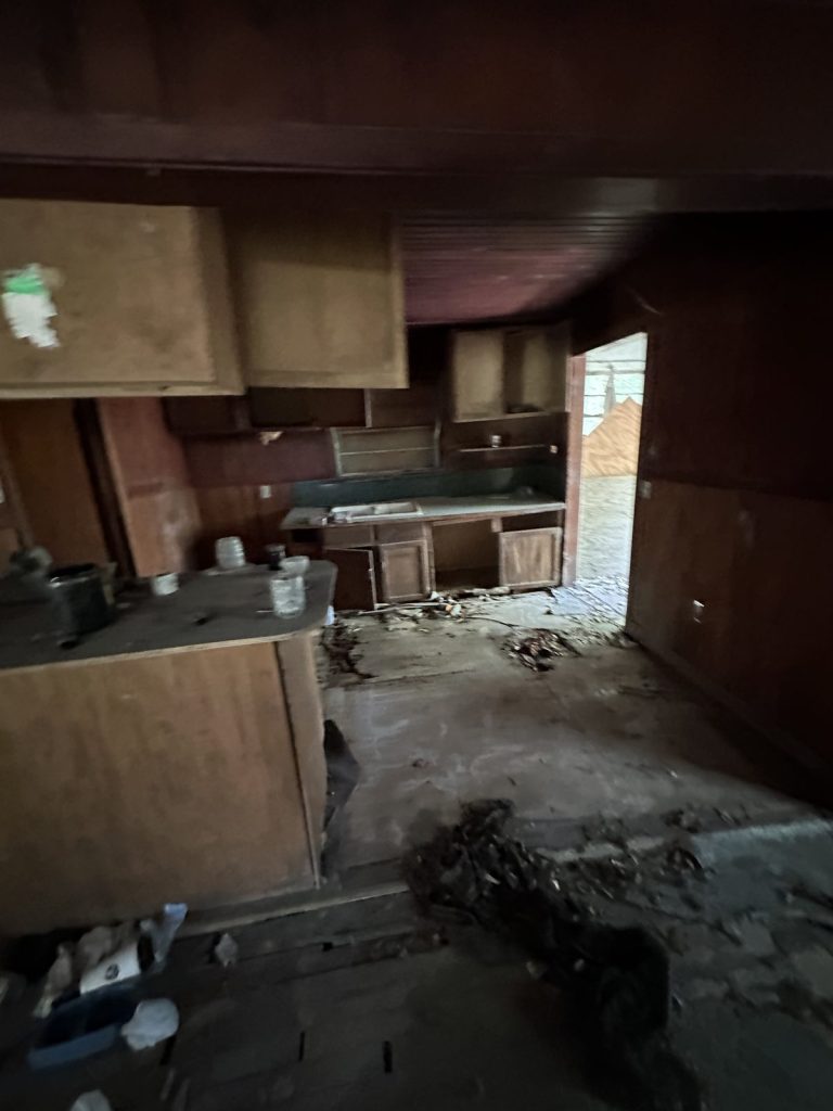 Ruined kitchen of severely distressed home purchased for cash by Volcan Property Buyers in Baytown TX