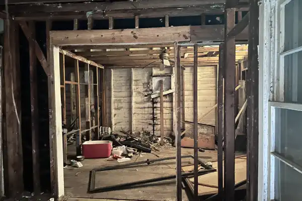 Interior of abandoned Lake Park Drive property with flood damage and major repair needs