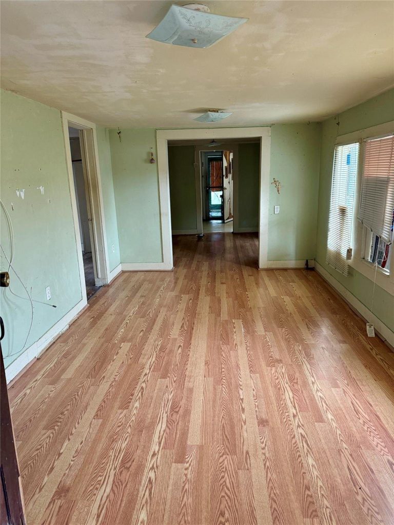 Empty bedroom of small older home sold as-is for cash in Airhart Amelia, Baytown TX