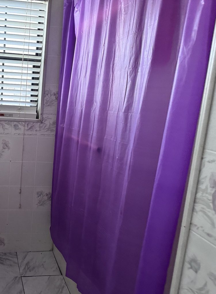 Dated bathroom of foreclosure home sold as-is for cash in Baytown TX