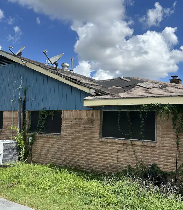 Missouri City house with major roof damage and repairs