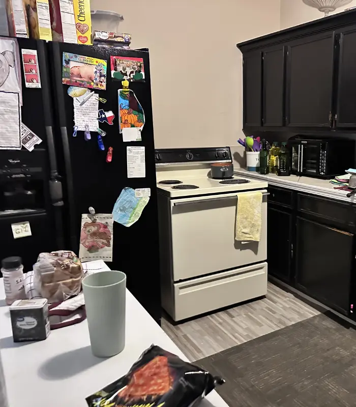 Interior utility area of a Rosenberg home requiring cleanup and organization before listing