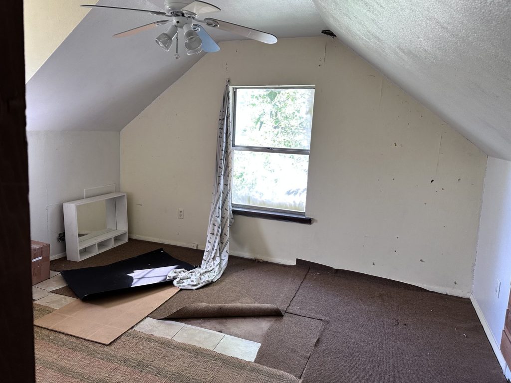 Upstairs room mid-repair in a termite-damaged home near Cypress, TX