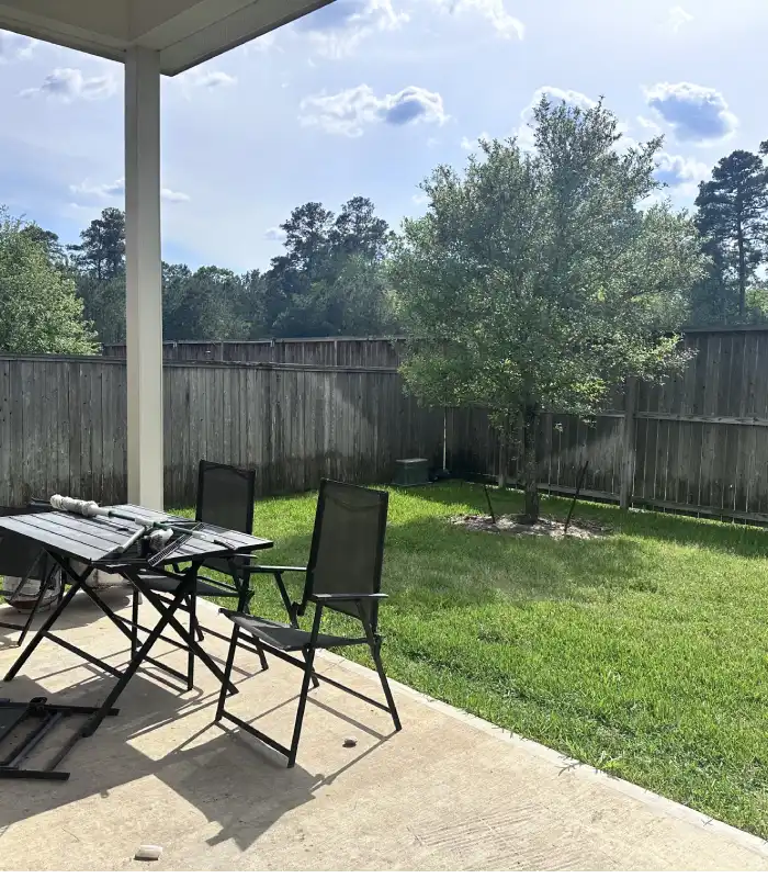Well-maintained backyard at a The Woodlands home