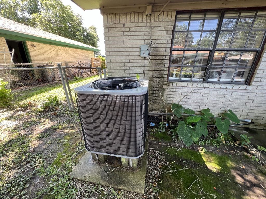 Brick side elevation of tenant-occupied rental purchased as-is in Texas City TX