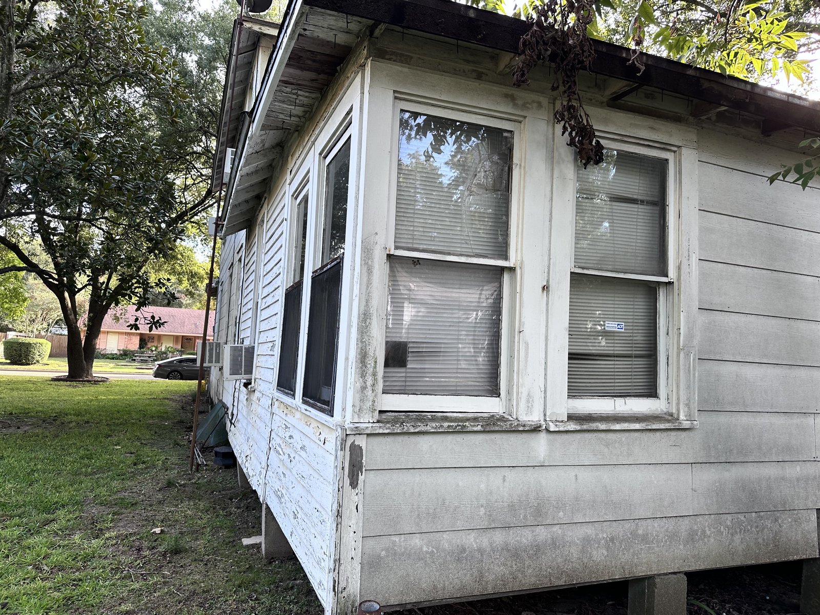 Side elevation of century-old as-is home bought for cash in North Texas City, Texas City TX