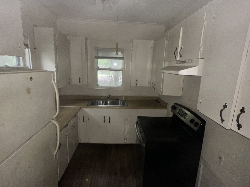 Dated kitchen in vacant as-is home bought for cash in La Marque TX