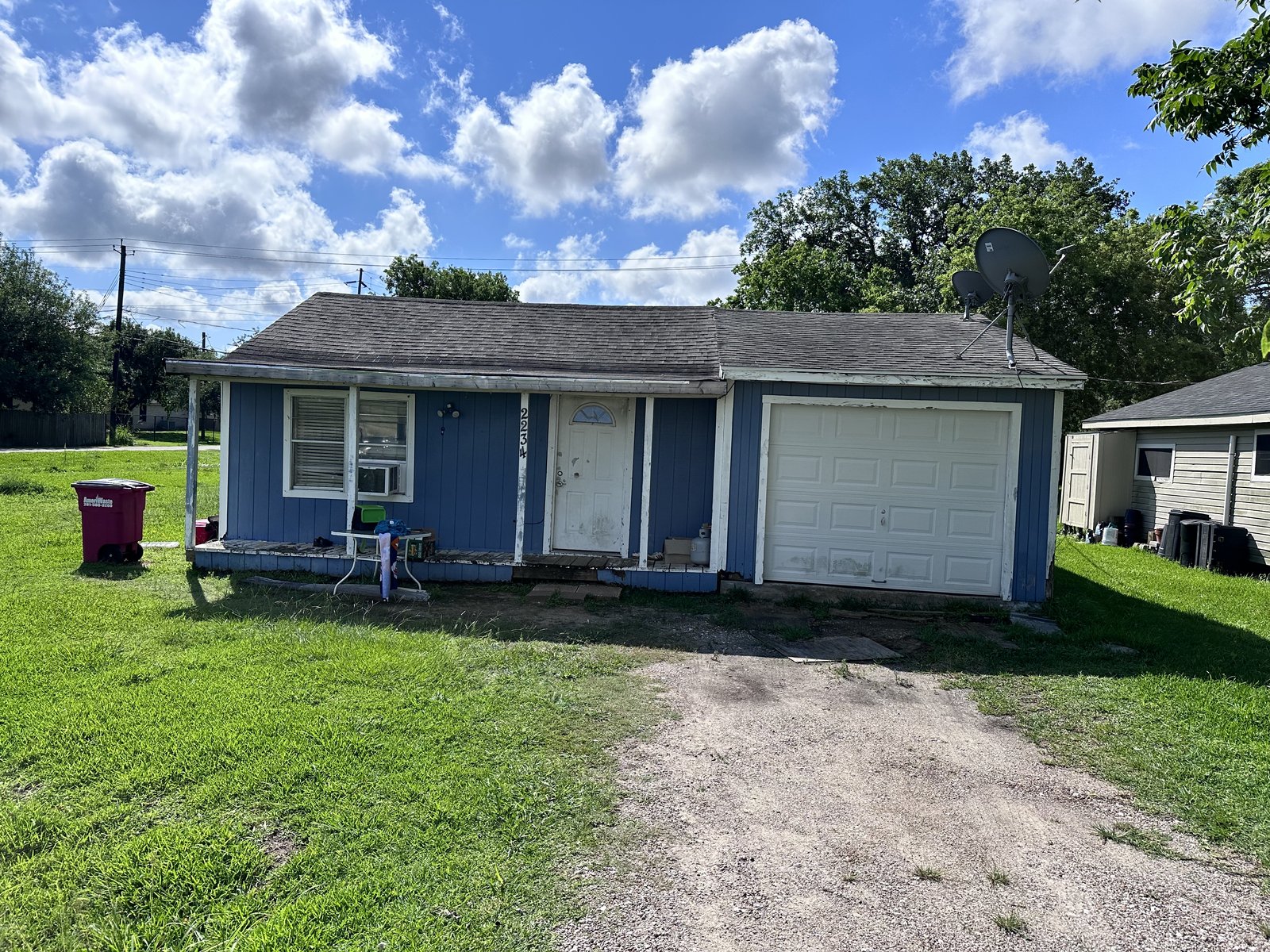 Front elevation of as-is home bought for cash in Freeport TX