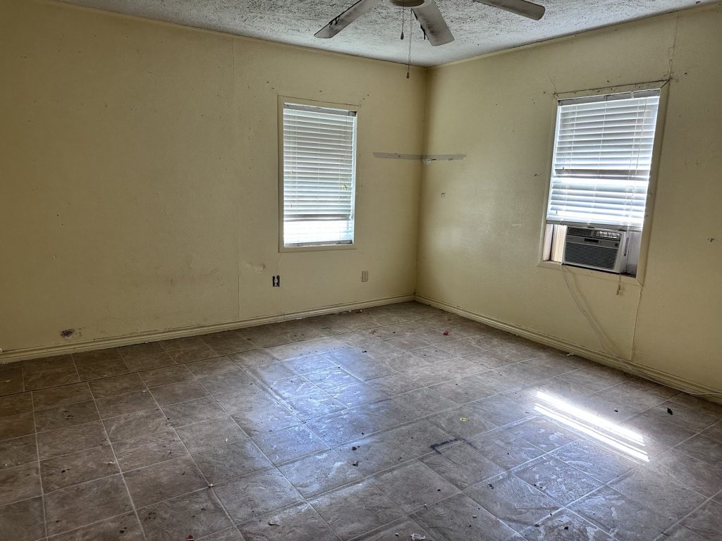 Emptied room prepared for a move in as-is home bought in Freeport TX
