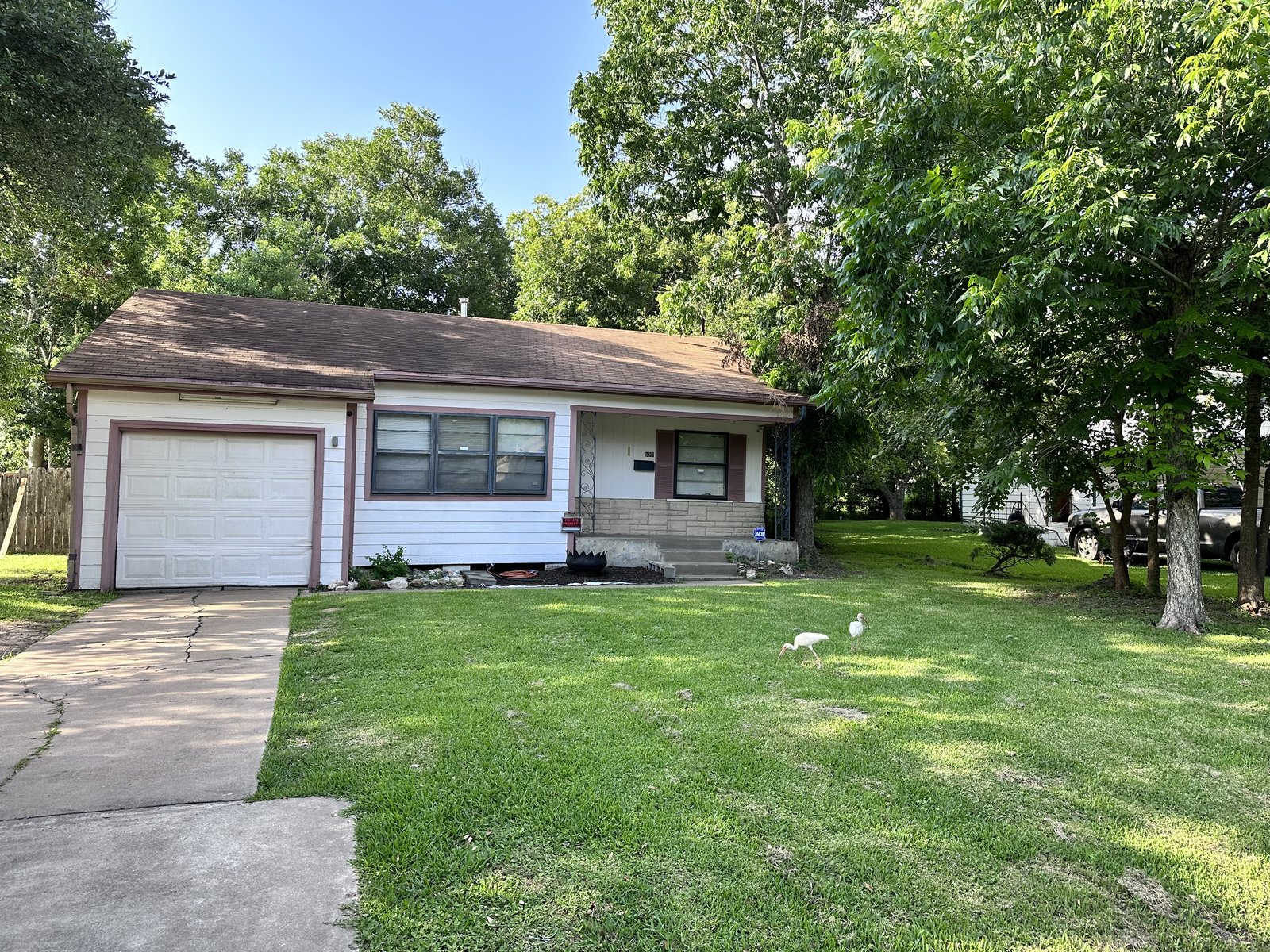 Front elevation of 1950s as-is rental home bought for cash in La Marque TX