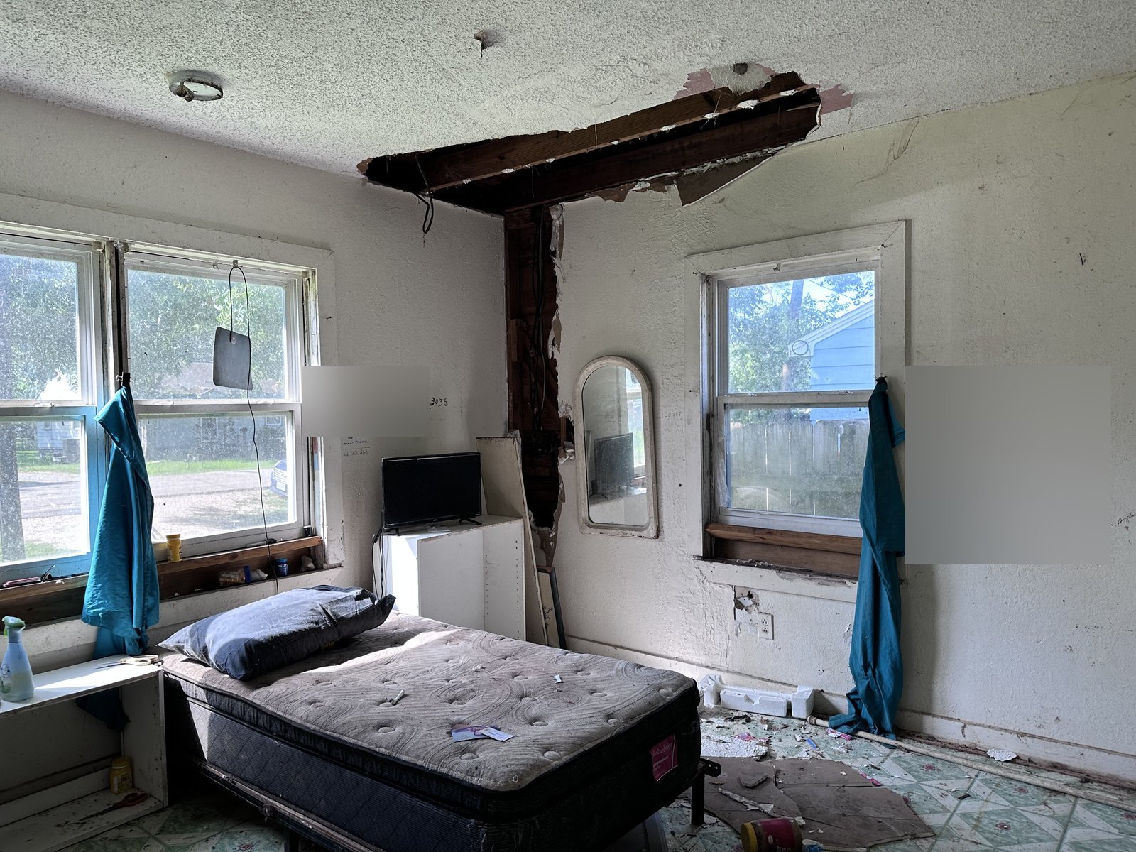 Collapsed ceiling and exposed joists in as-is home bought for cash in La Marque TX