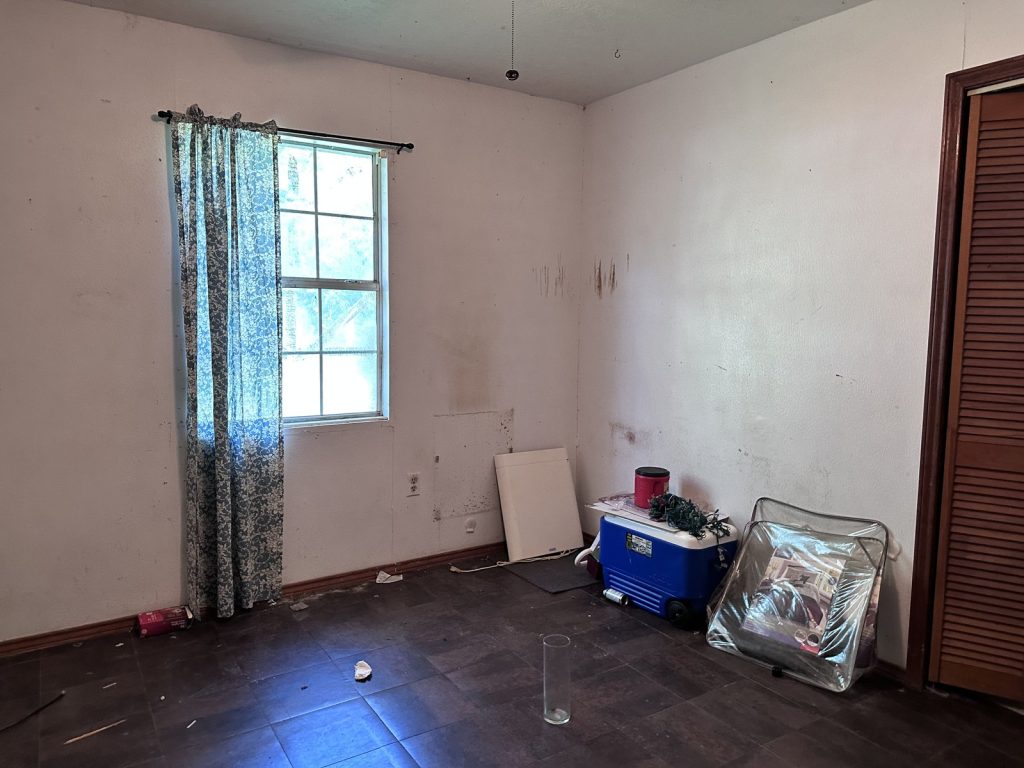 Water-stained interior of as-is home purchased for cash in La Porte TX