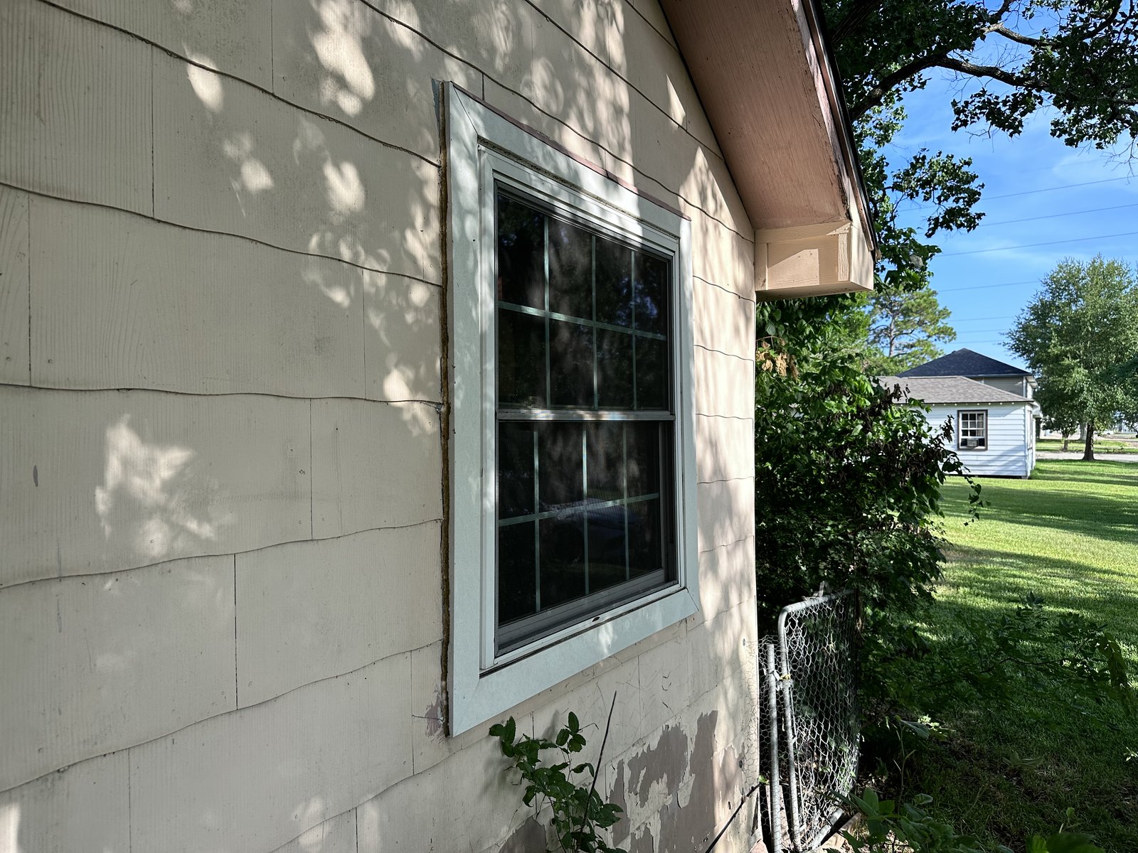Side elevation of as-is home bought for cash in La Porte TX