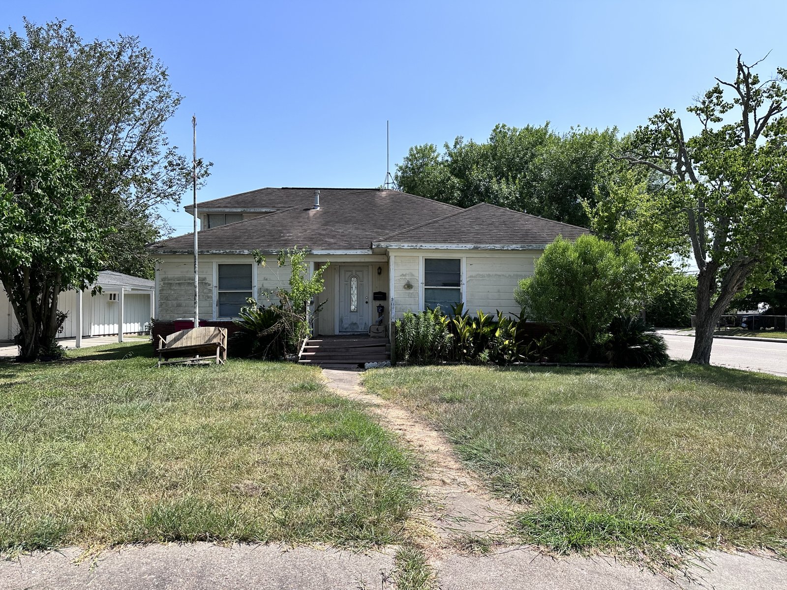 Front elevation of inherited as-is home bought for cash in Freeport TX