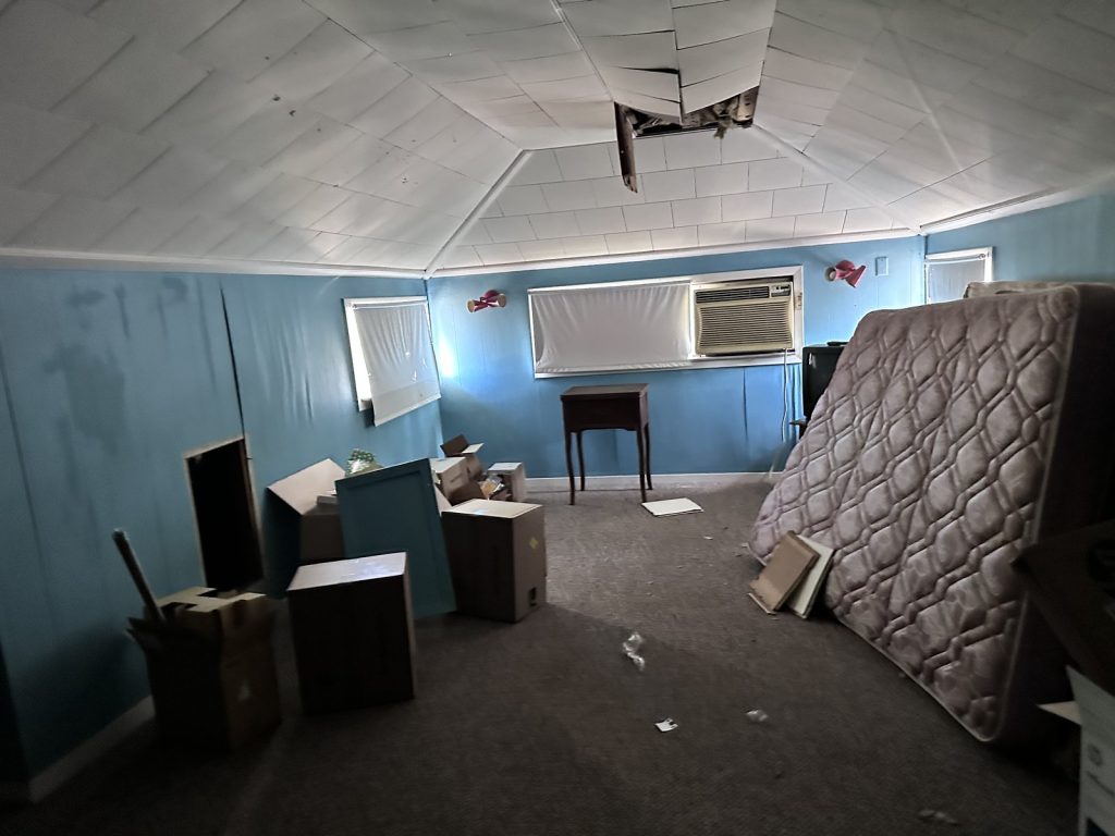 Collapsed ceiling section in inherited as-is home purchased in Freeport TX