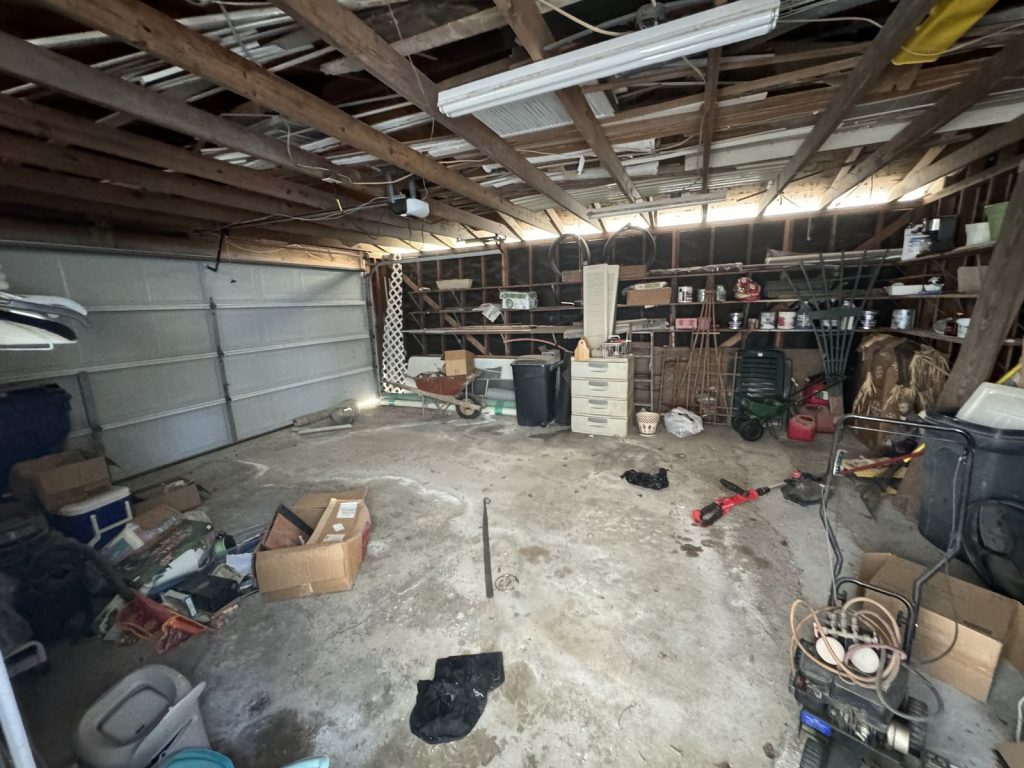 Garage left full of contents in as-is home purchased for cash in Texas City TX