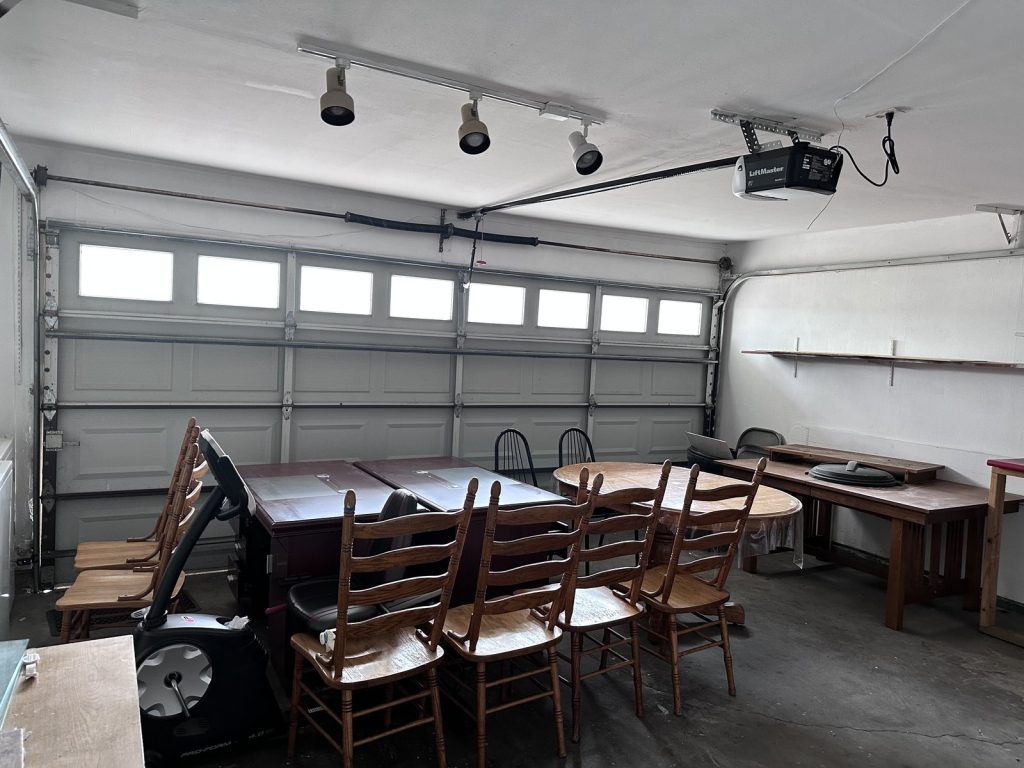 Garage full of stored furniture in Memorial Grove Houston TX house sold as-is