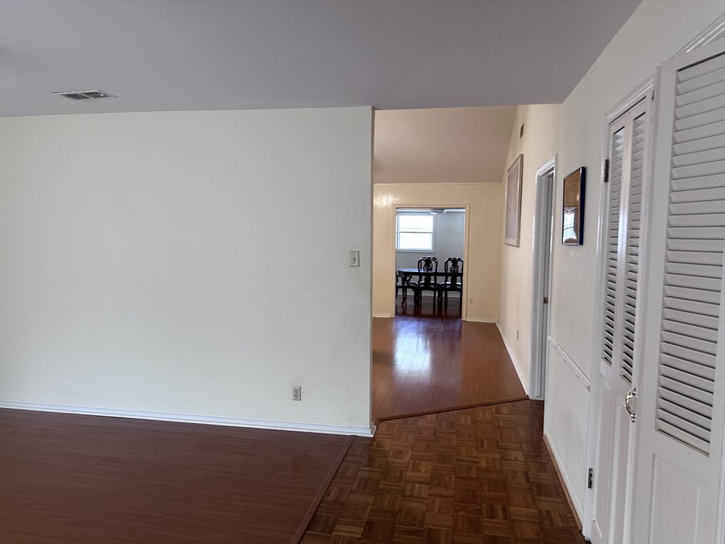 Dated living and dining area in Houston TX home that would not sell on the market