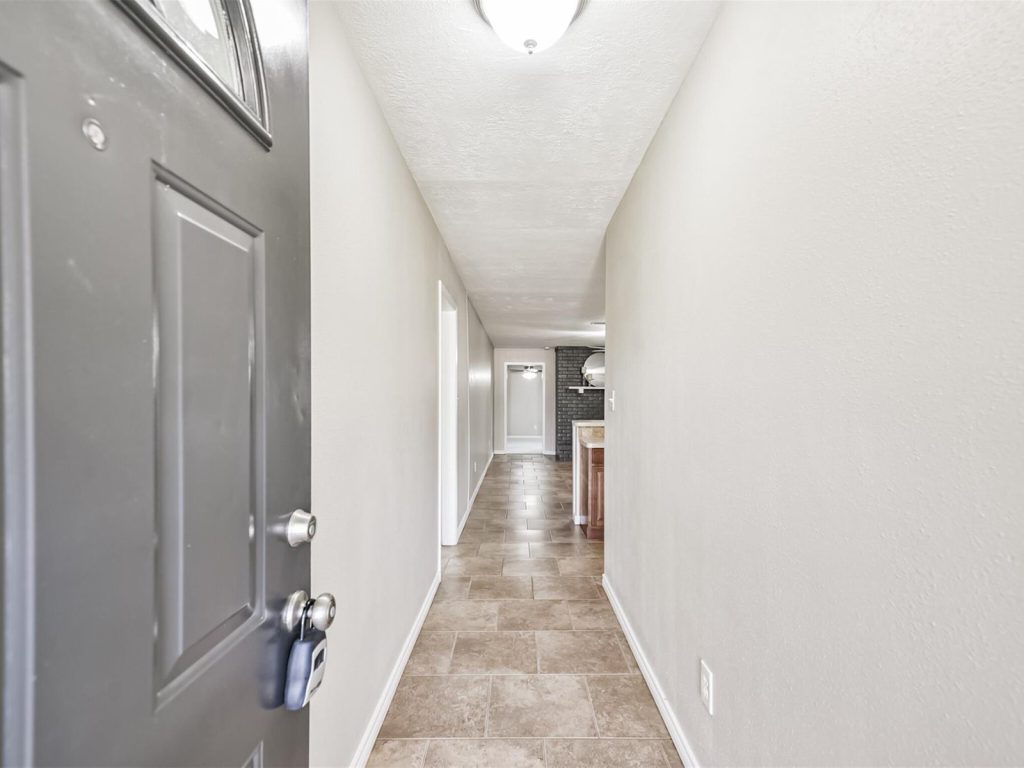 Interior hallway in a Shore Acres, La Porte TX home purchased for cash
