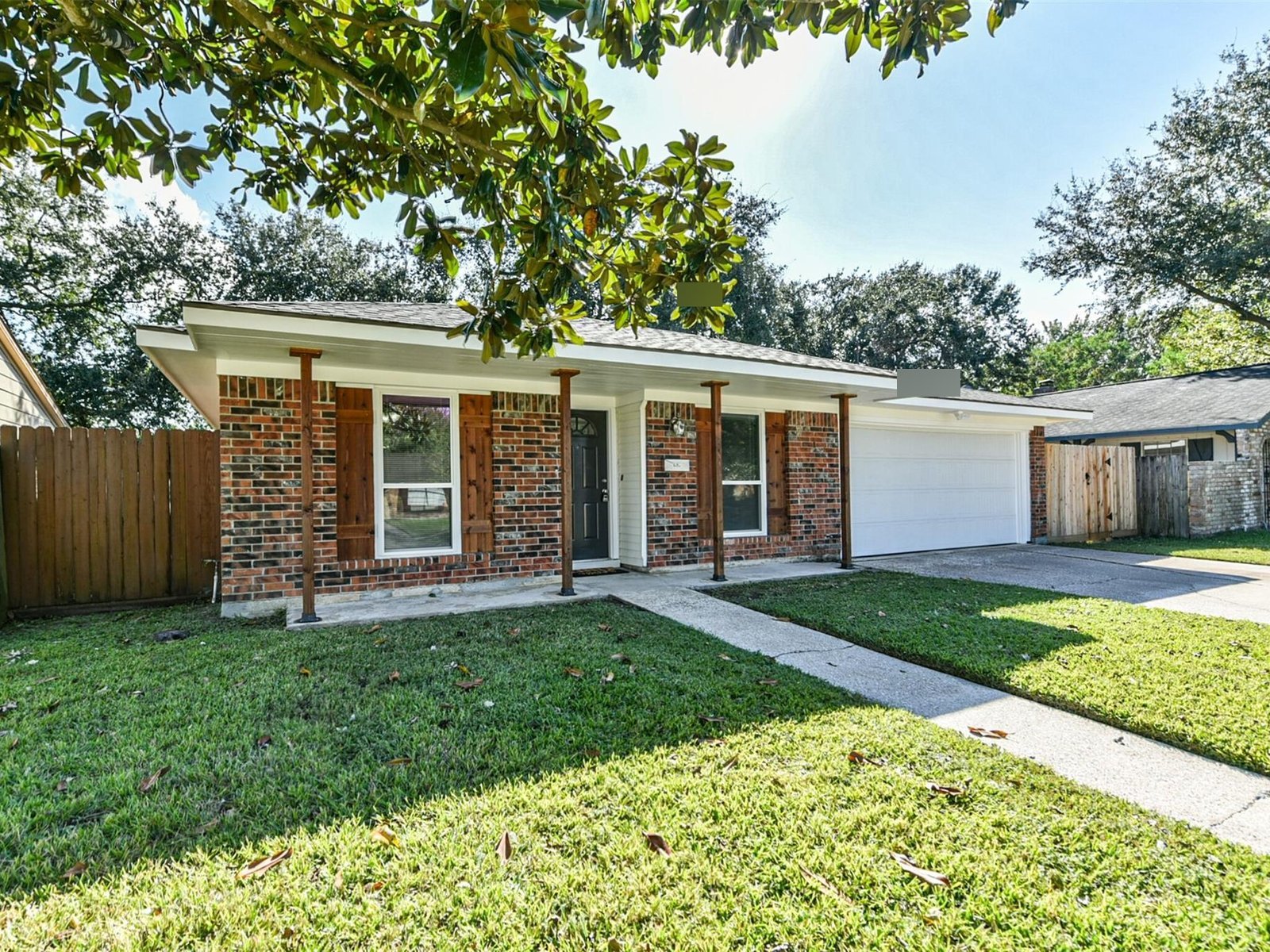 Front exterior of a well-kept brick home in Shore Acres, La Porte TX sold for cash