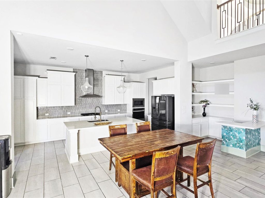 Open kitchen and dining area in a Katy TX foreclosure home sold for cash