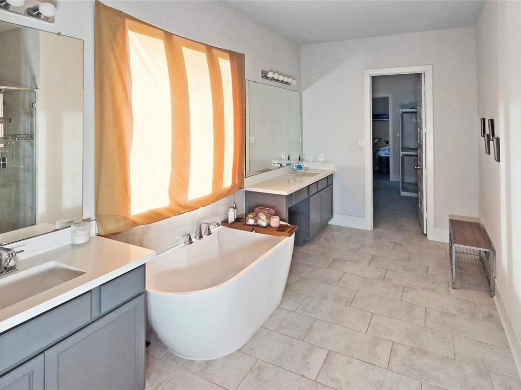 Primary bathroom with soaking tub in a Bellwick Crest home in Katy, TX