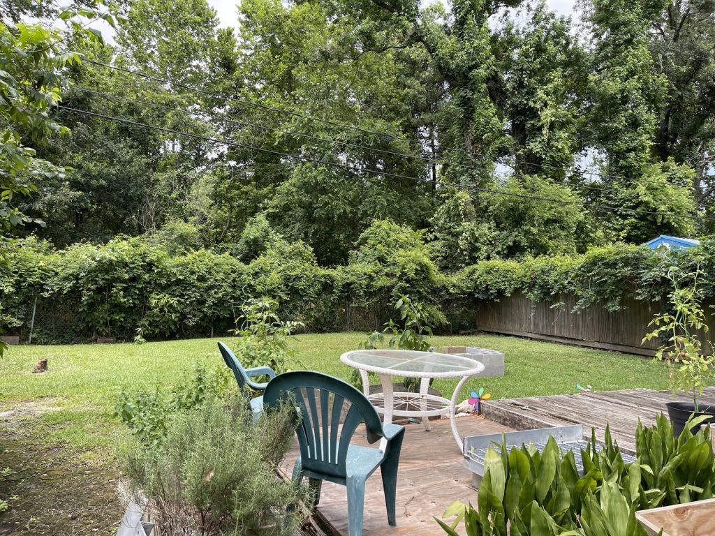 Shaded backyard at a Rolling Hills home in East Houston, TX sold for cash