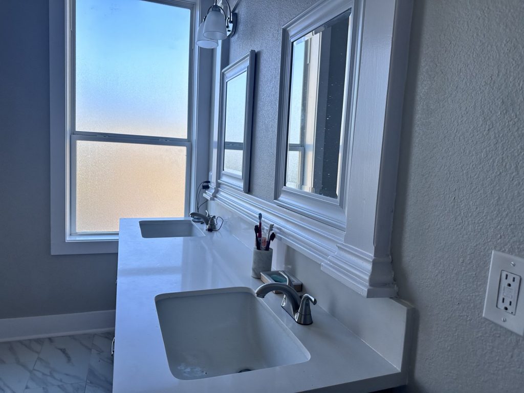 Bathroom vanity inside an Oak Forest, Houston home sold in a discreet divorce sale