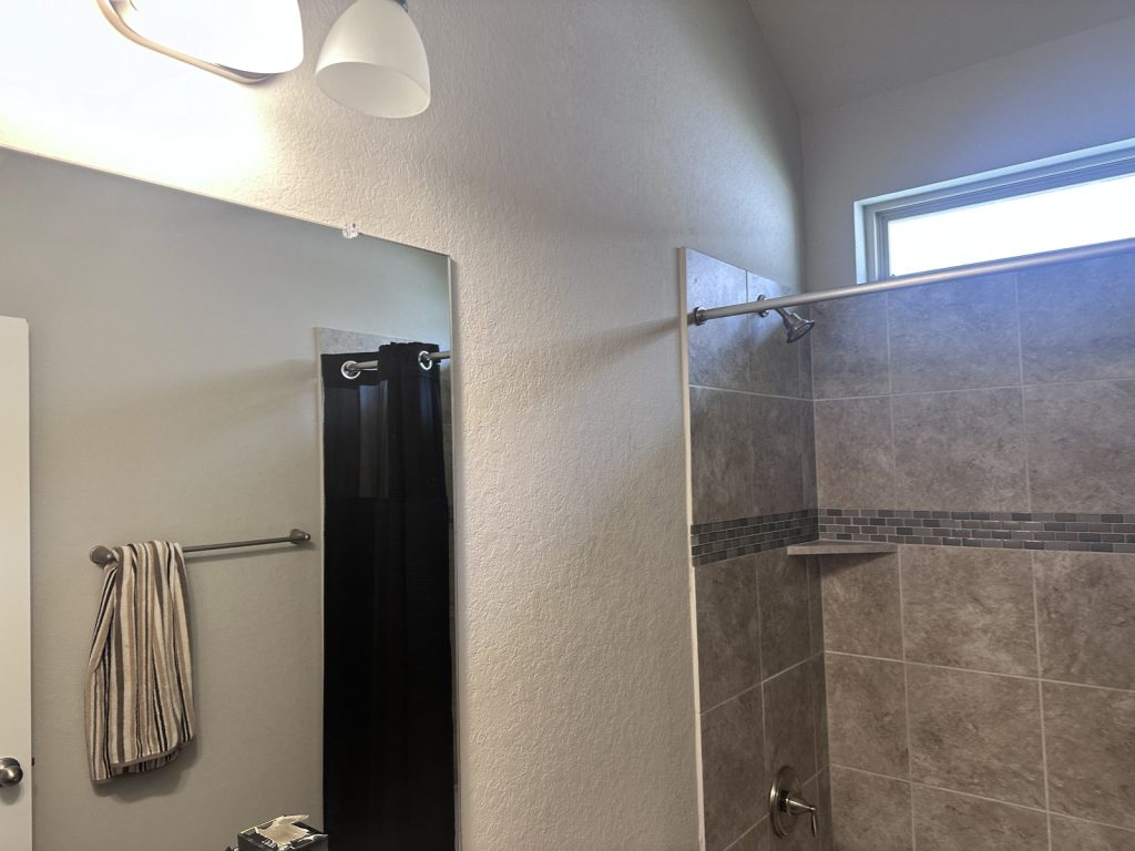 Updated bathroom at a Sterling Ridge home in The Woodlands, TX purchased for cash