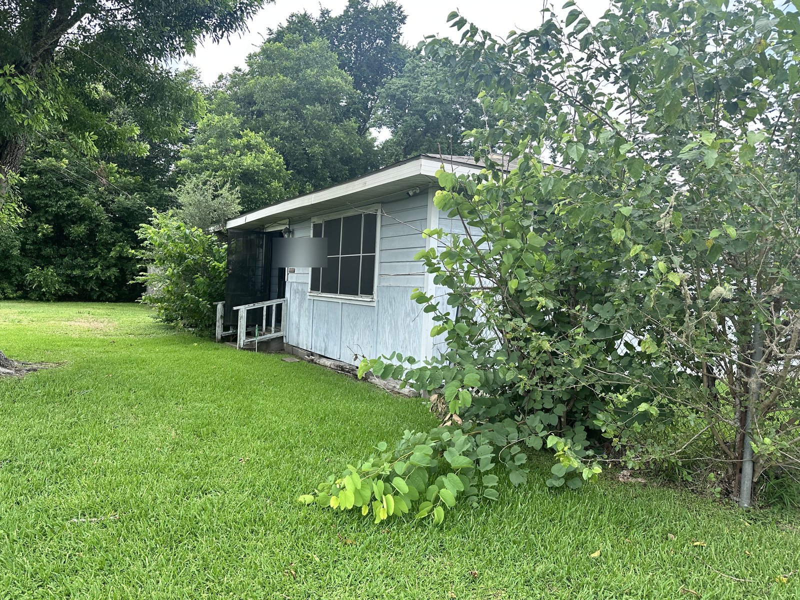 Front view of as-is frame home with structural issues bought for cash in Clearview Manor, Houston TX