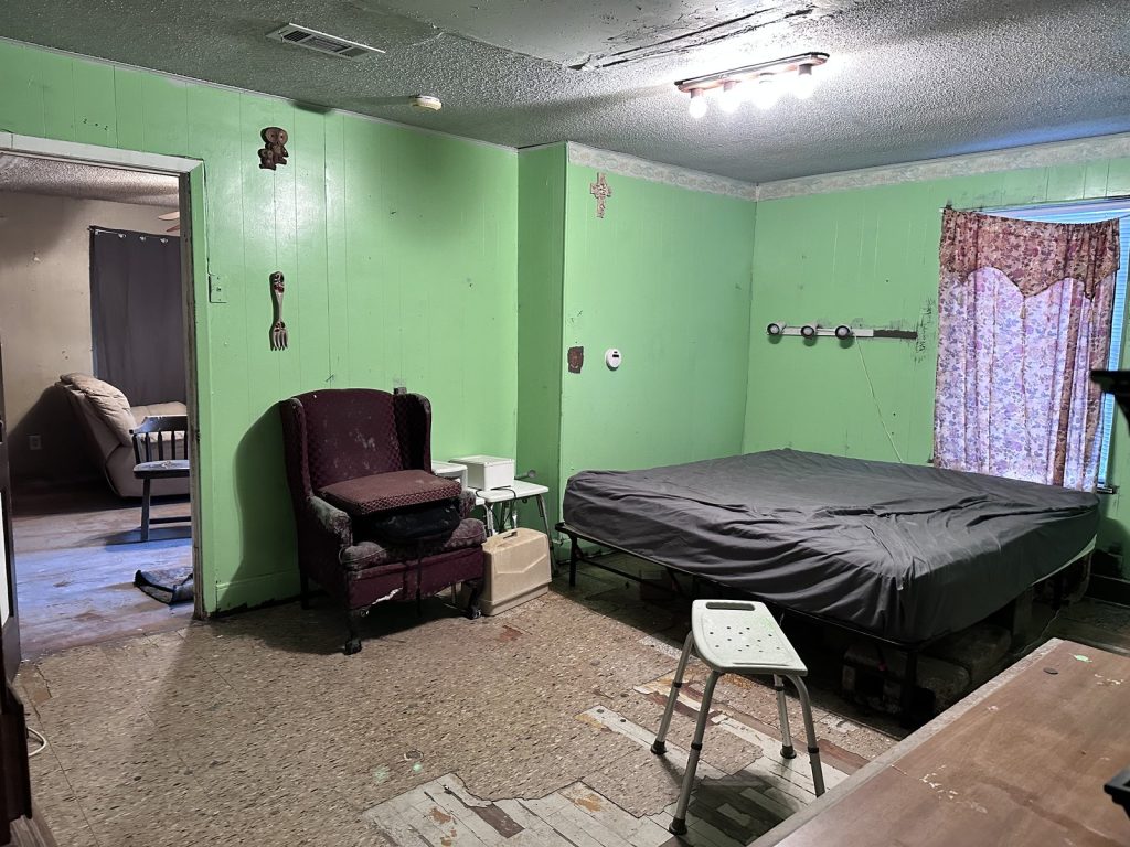 Second bedroom in an abandoned Kashmere Gardens, Houston TX estate property bought as-is