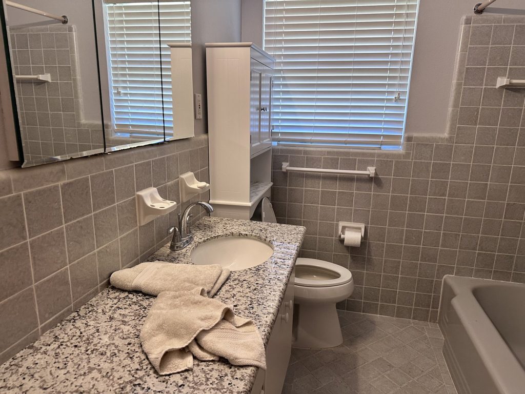 Updated bathroom in Outpost Estates Houston TX home bought by cash home buyers