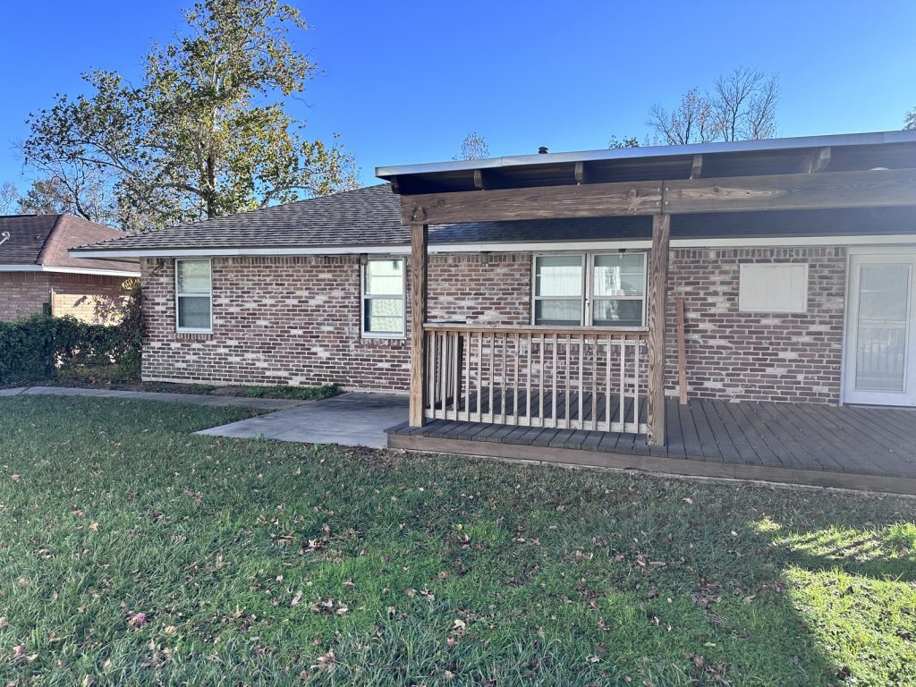 Covered rear deck of west Houston TX house purchased for cash from a downsizing owner