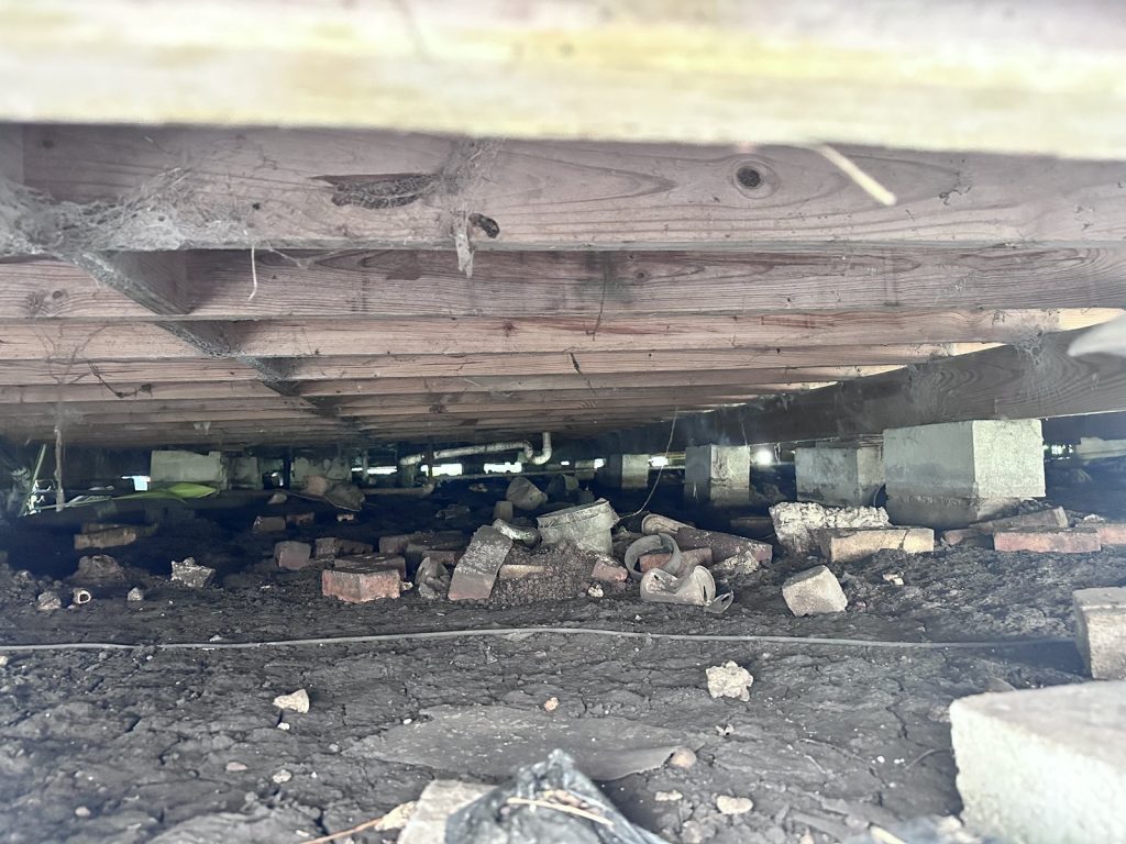 Pier-and-beam foundation crawlspace at a Richmond, TX home purchased for cash