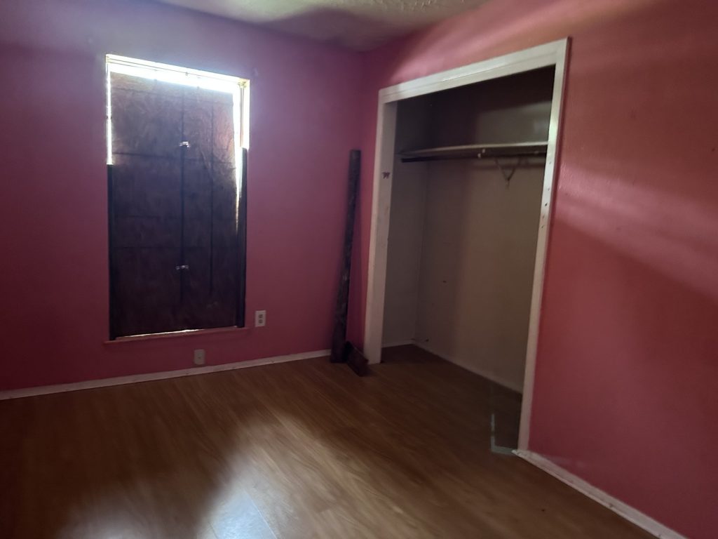 Bedroom inside a Willowood, Houston home purchased after a squatter was legally removed