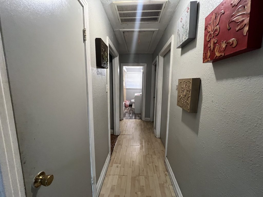 Hallway of 1950s Oak Meadows home purchased by Houston cash home buyers
