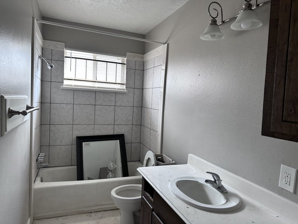 Bathroom in an inherited Fairgreen Drive home in Missouri City, TX sold as-is