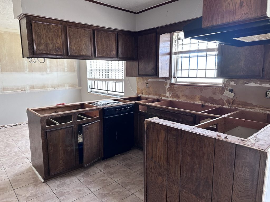 Partially demolished kitchen mid-renovation in a Fairgreen Drive home, Missouri City TX